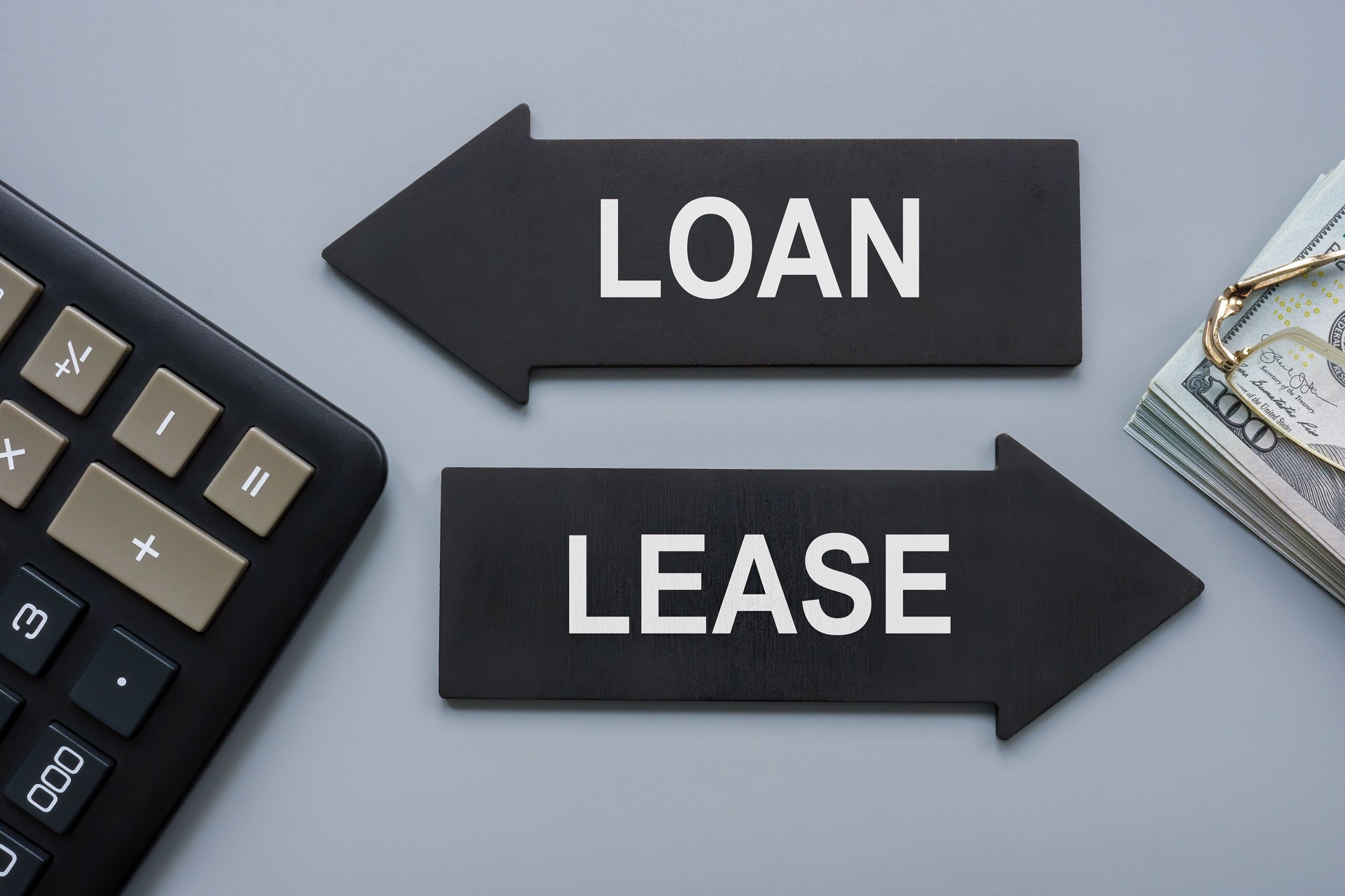 Arrows with signs Loan or lease for choice.