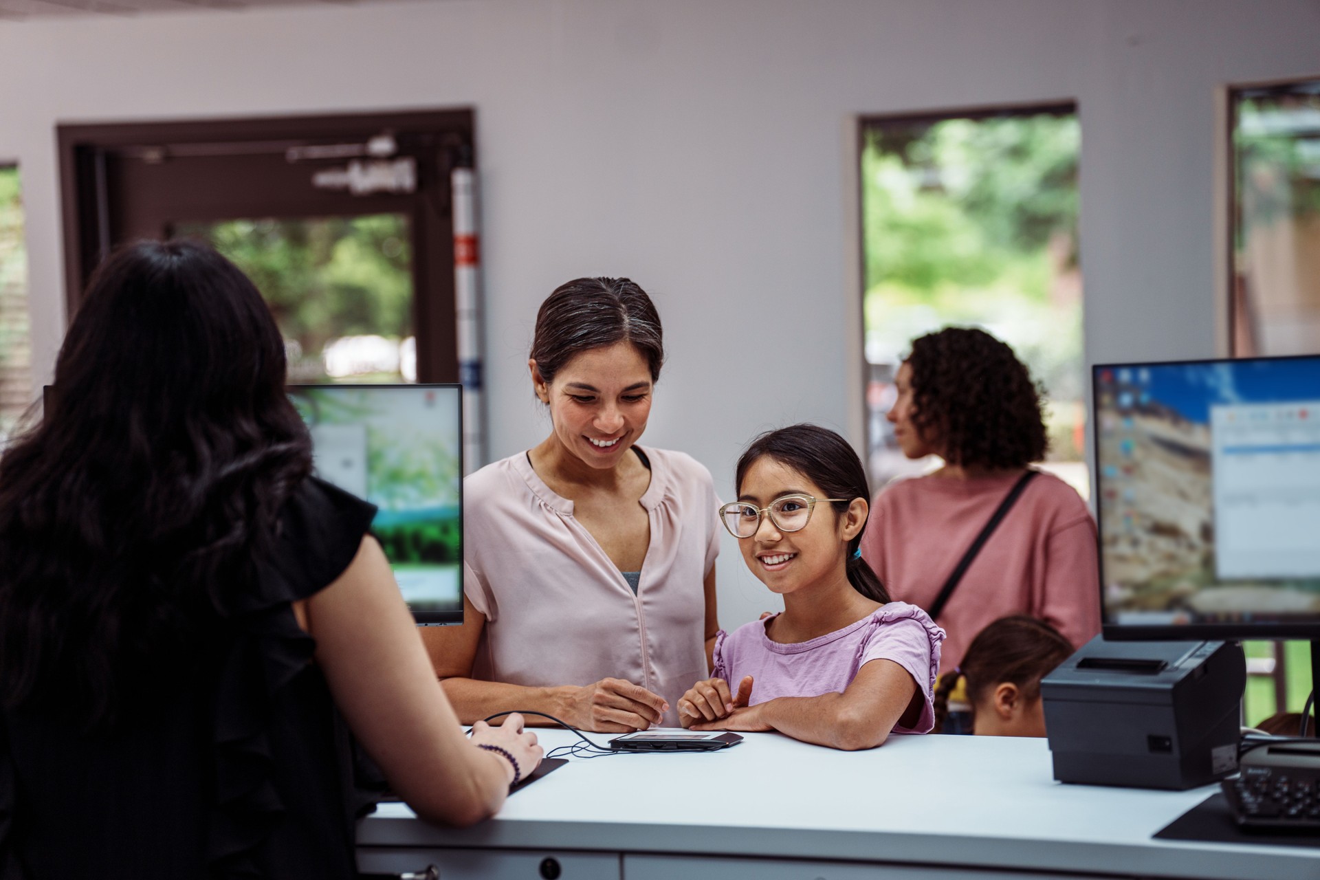 Preteen girl opening savings account at credit union